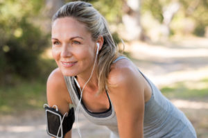 athletic mature woman resting after jogging